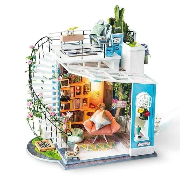 Miniature dollhouse with spiral staircase and vibrant cozy living room in a Tes product