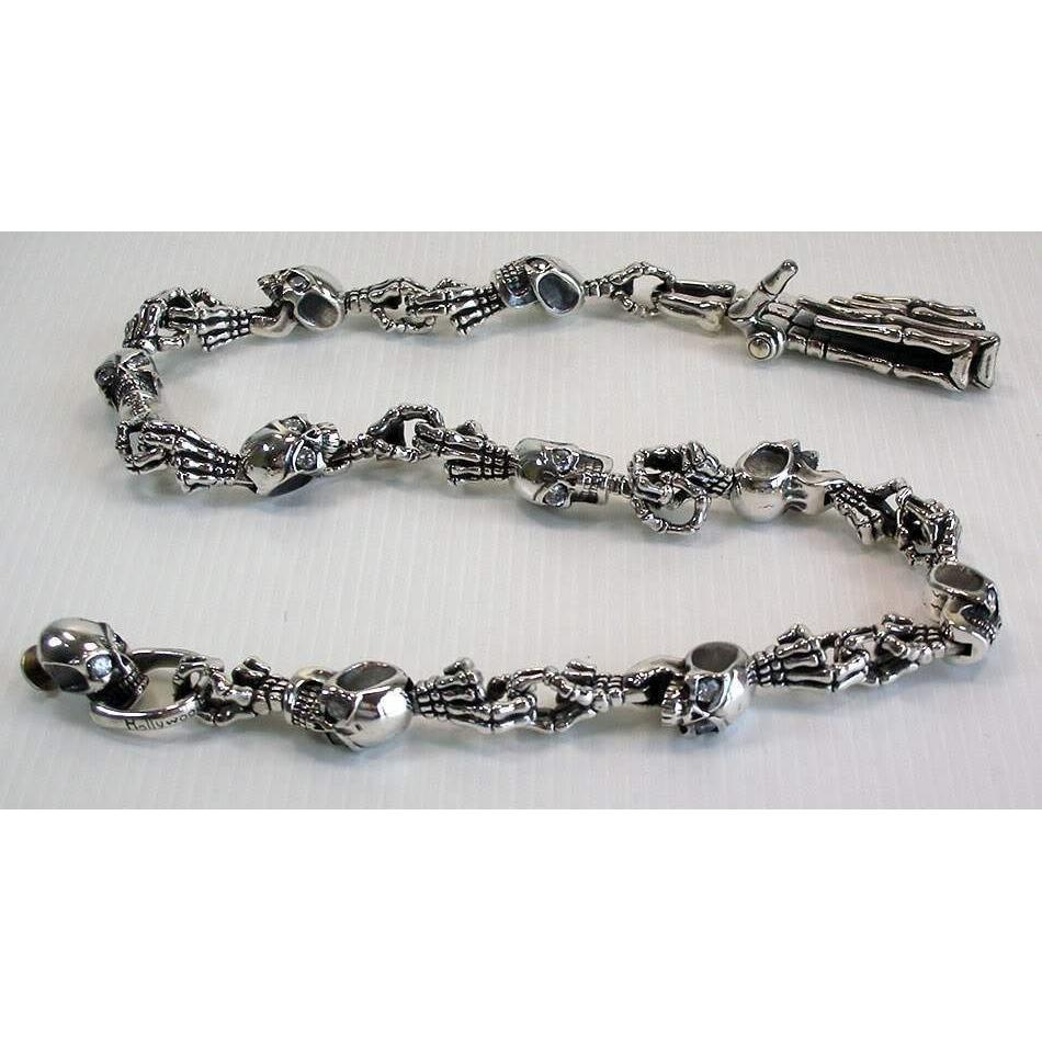 Silver skull and crossbones chain bracelet displayed with Pink Rimless Sunglasses for Cinéma Events