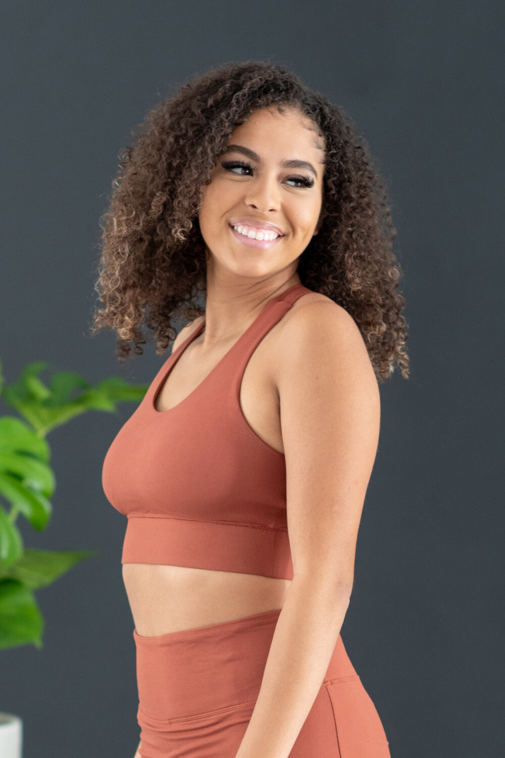 Terracotta sports bra and leggings set with racerback design and stretchy fabric for comfort