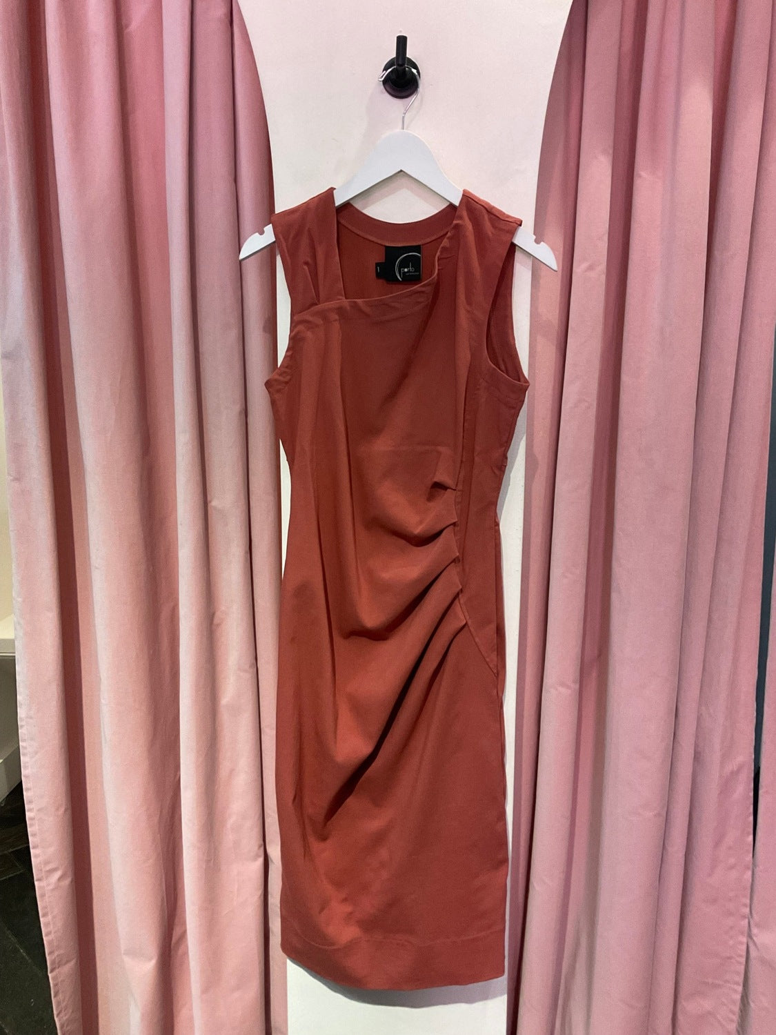Rust-colored sleeveless dress with subtle sheen and minimalist design from A A A A Tes