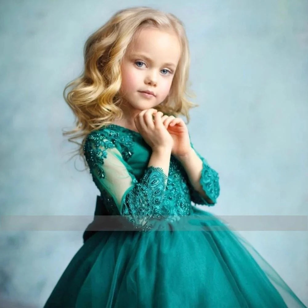 Emerald green lace and tulle dress with long sleeves displayed on A Sticker Product