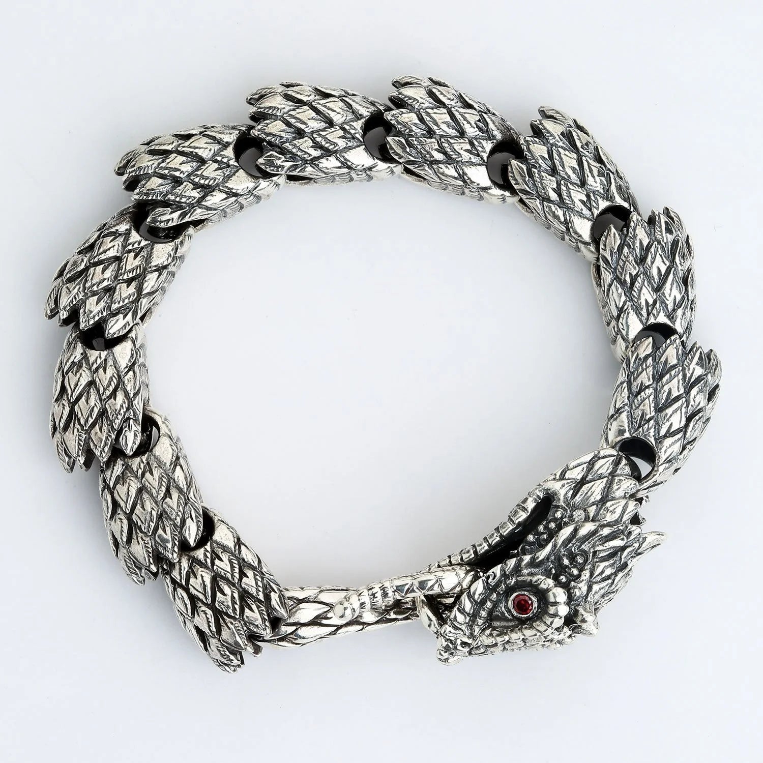 Silver dragon bracelet with red eyes and scales design from Bali collection