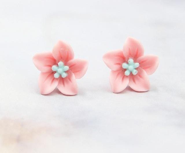 Pink flower stud earrings with light blue centers on Swap Images Product