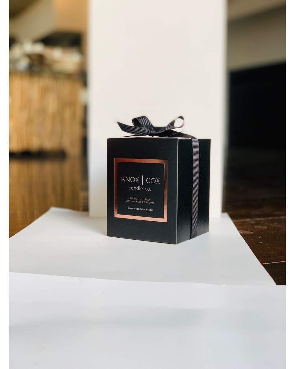 Black Knox Cox candle box with gold accents and bow for Latest Product 3 Images