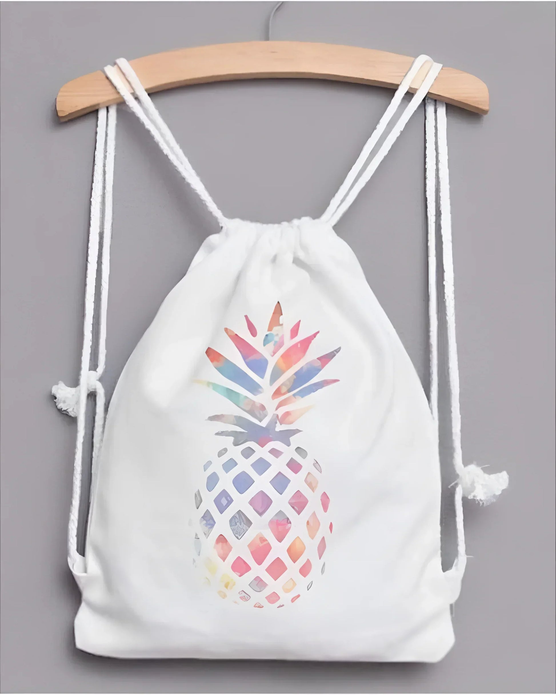 White pineapple drawstring backpack with colorful watercolor design on front for stylish storage