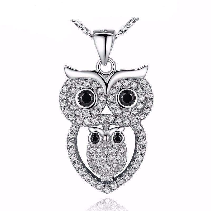 Silver owl pendant with black eyes and clear gemstones for Zip Product jewelry display