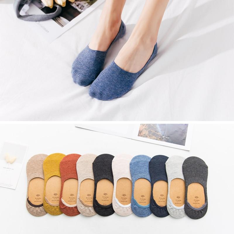 No-show socks in various colors and patterns from Zip Product, including navy blue and mustard yellow
