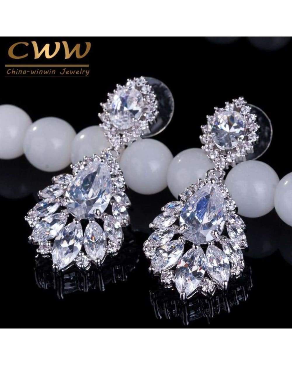 Sparkling silver-toned drop earrings with clear cubic zirconia stones displayed in Swap Images Product