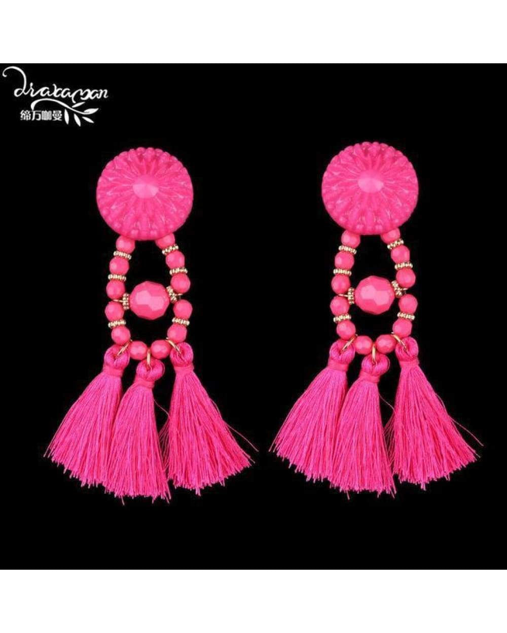 Bright pink tassel earrings with beaded accents from Swap Images Product