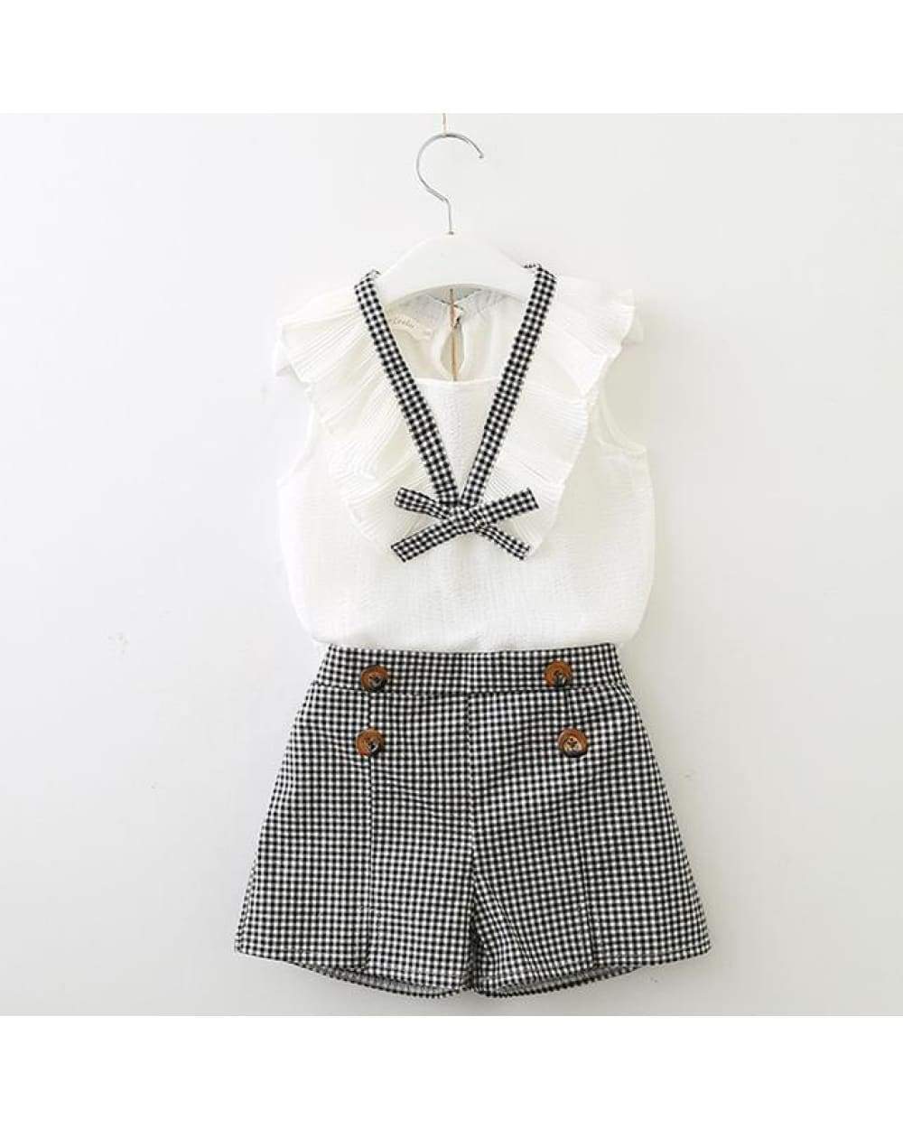 White and black gingham shorts with wooden buttons and ruffled bow tie top