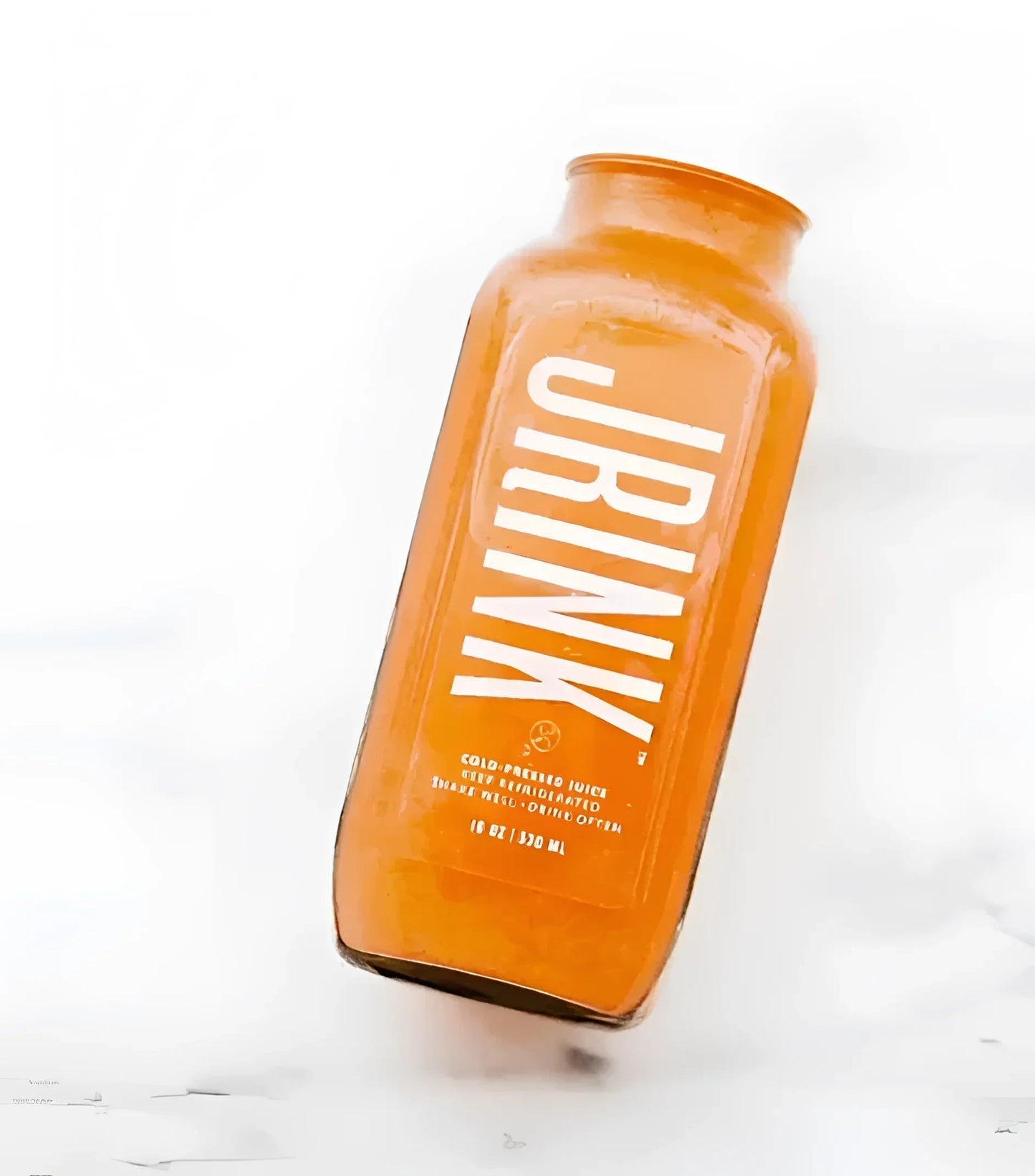 Orange glass bottle with white text Jrink and modern design for Background Credit Test