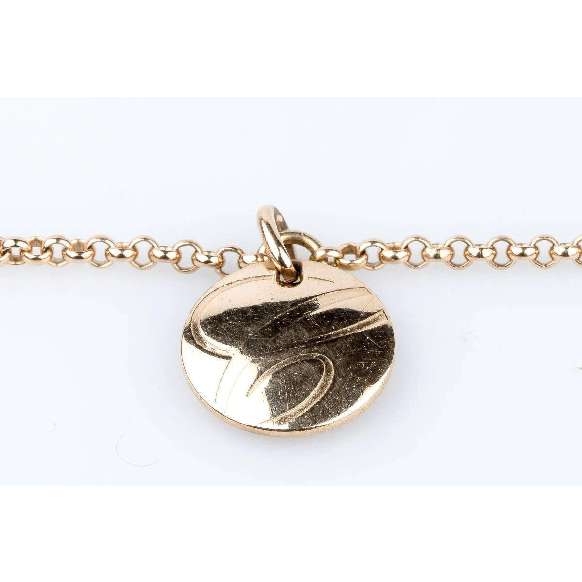 Gold shark tooth charm bracelet displayed in TESTING 5 IMAGES product photo