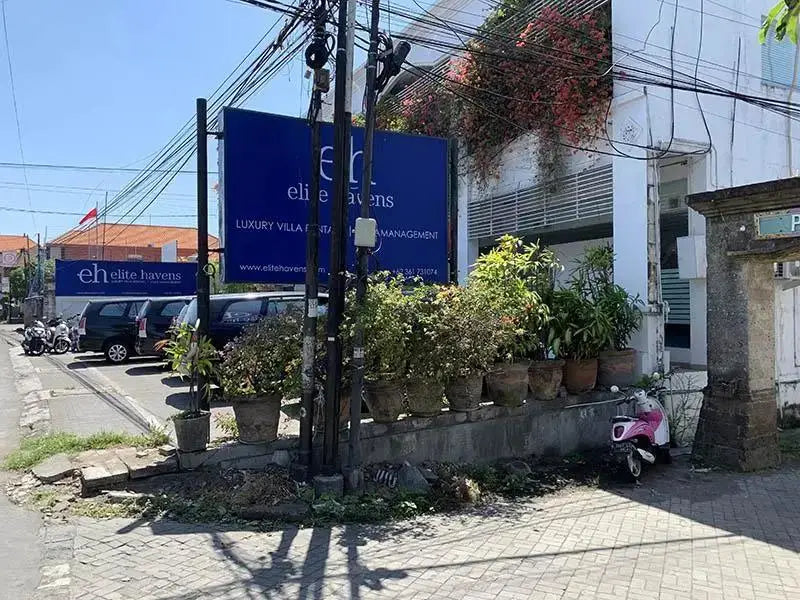 Summer Street With Sign And Parked Car