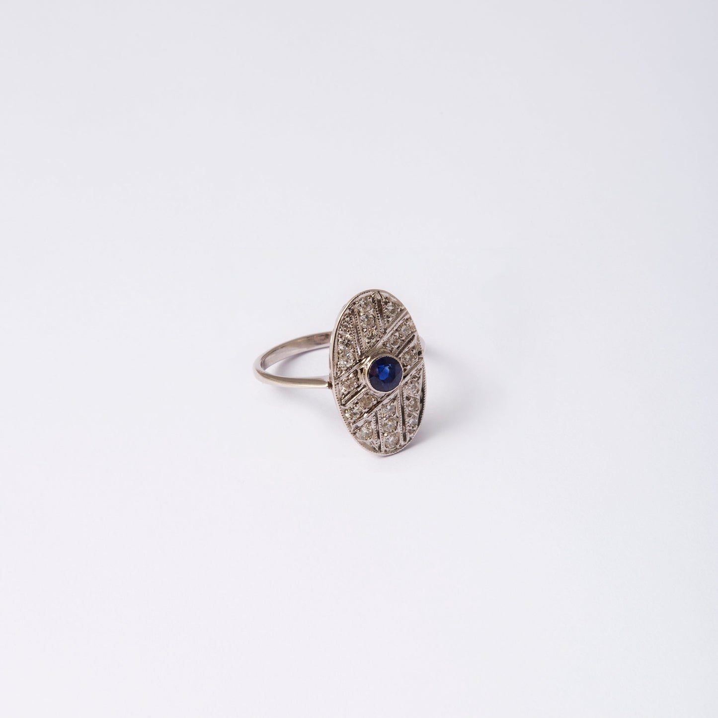 Silver textured ring with a blue stone center from the NP3 collection