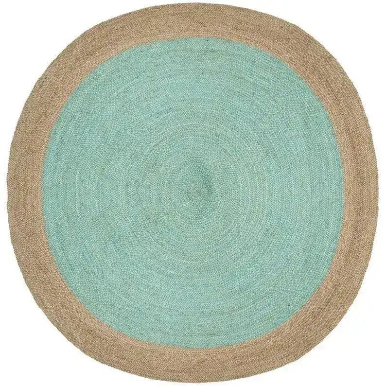 Circular jute rug with teal center and natural beige border featuring gold embroidered lb logo for pump street mini bars