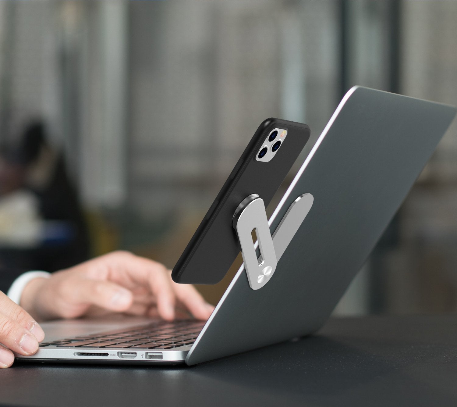 Silver laptop stand with black phone holder for ergonomic support and device access