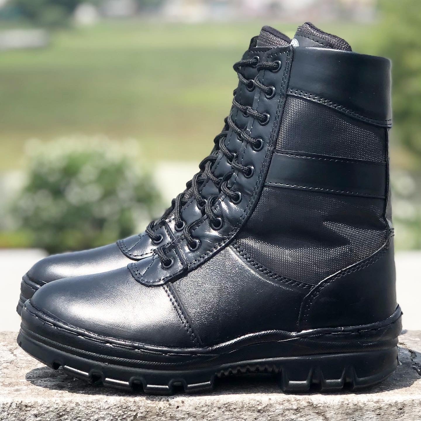 Gray Aviator black leather combat boots with laces and textured soles