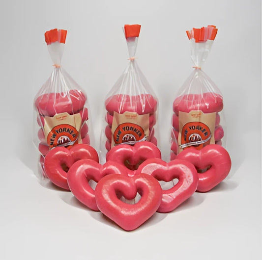 Bright pink heart bagels in clear bags with orange caps branded new yorker bagels for valentine’s day heart bagels test