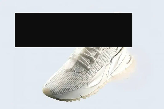 White mesh sneaker with a sleek, modern design and subtle silver accents on the midsole