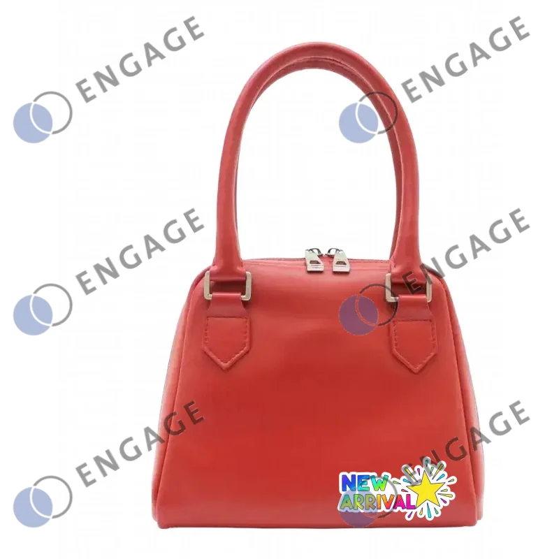 A sleek coral-red leather handbag with silver hardware perfect for carrying your balancing facial toner daily