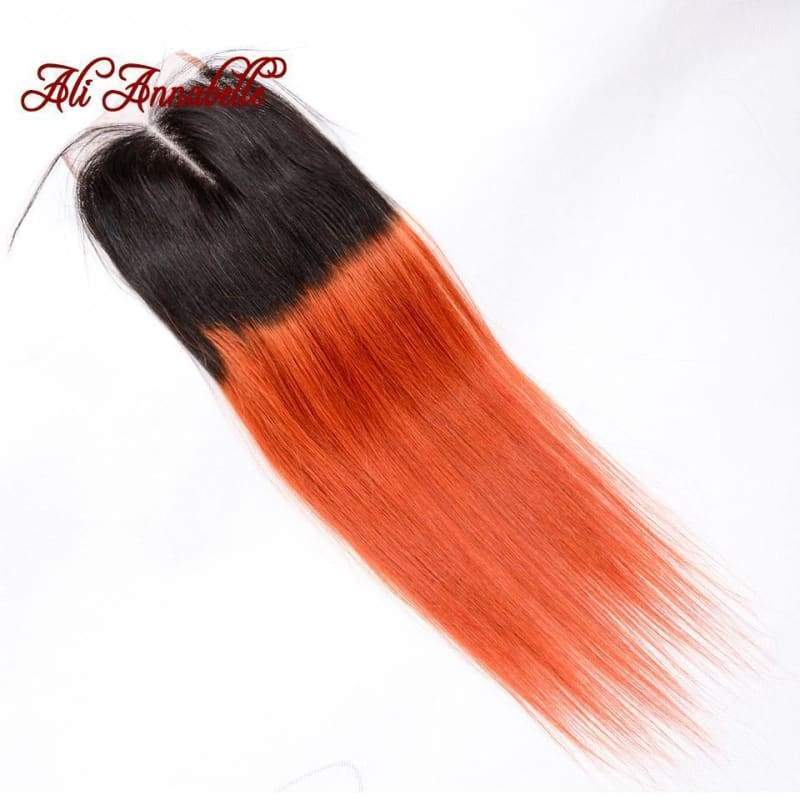 Straight hair extension with black roots and orange ends on Blue Superman Baseball Cap