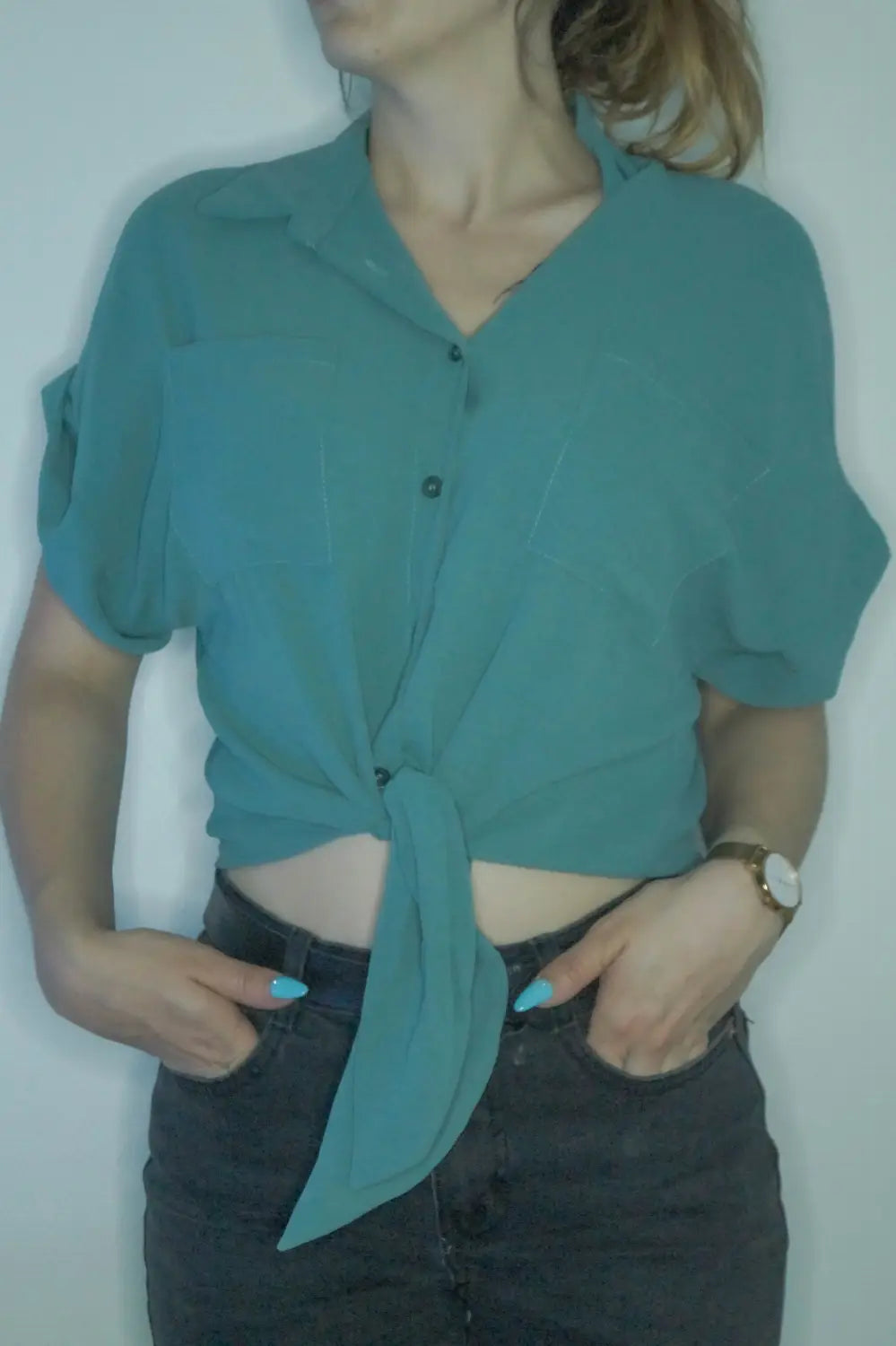 Teal silk blouse with ruffled sleeves and tied waist for stylish clothing options
