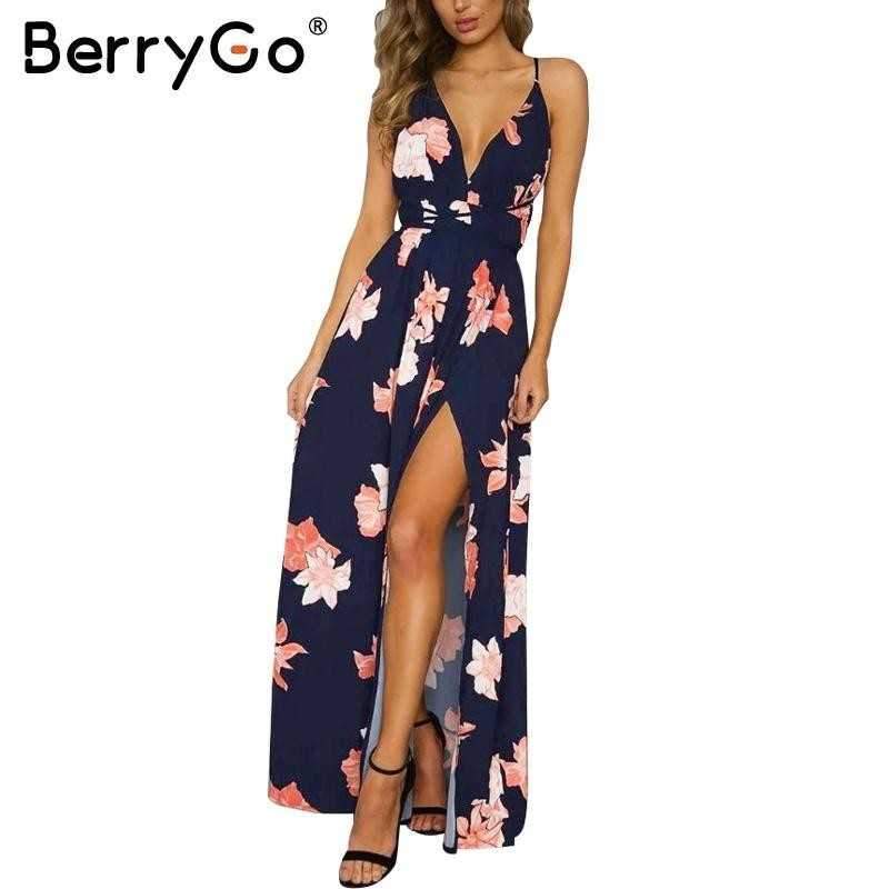 Navy blue floral maxi dress with spaghetti straps and side slit on a transparent PNG