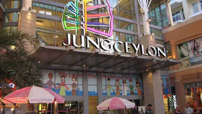 The upscale test new entrance features a brightly lit colorful neon jungeceylon sign with a leaf design perfect for fitness fans