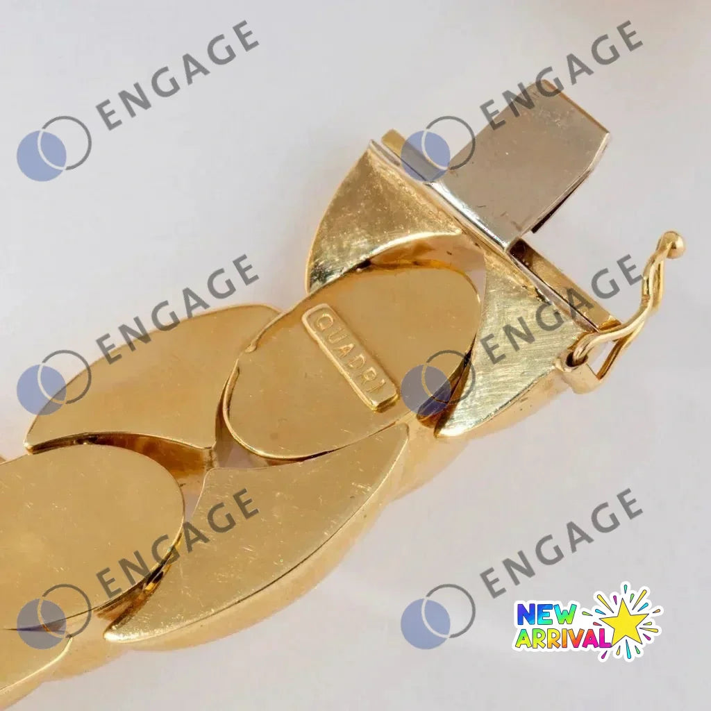 Gold chain link bracelet with textured clasp and logo for Leisure Tapis Chien Teckel
