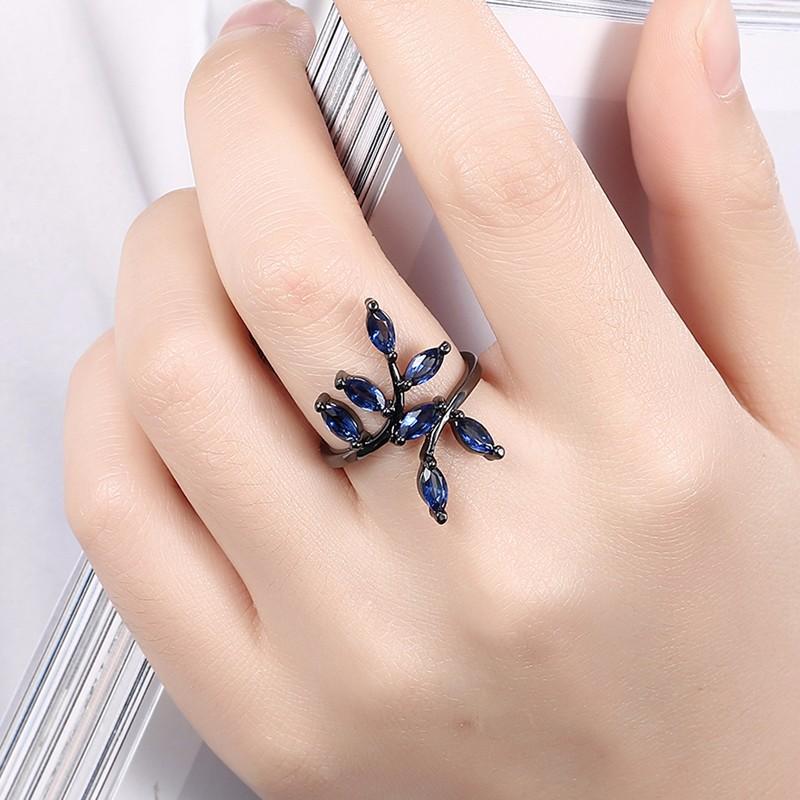 Silver dragonfly ring with blue gemstones and black accents from Test BG Photos