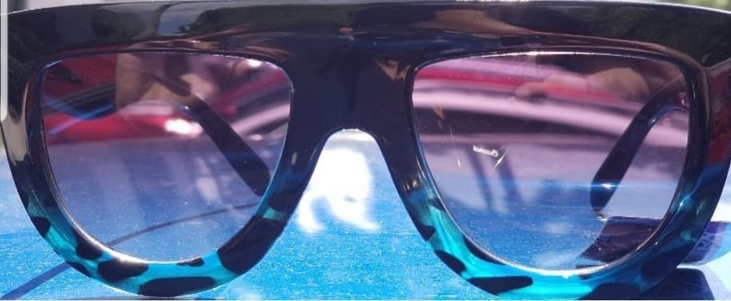 Blue gradient sunglasses with a black frame, a trendy accessory for hipster style