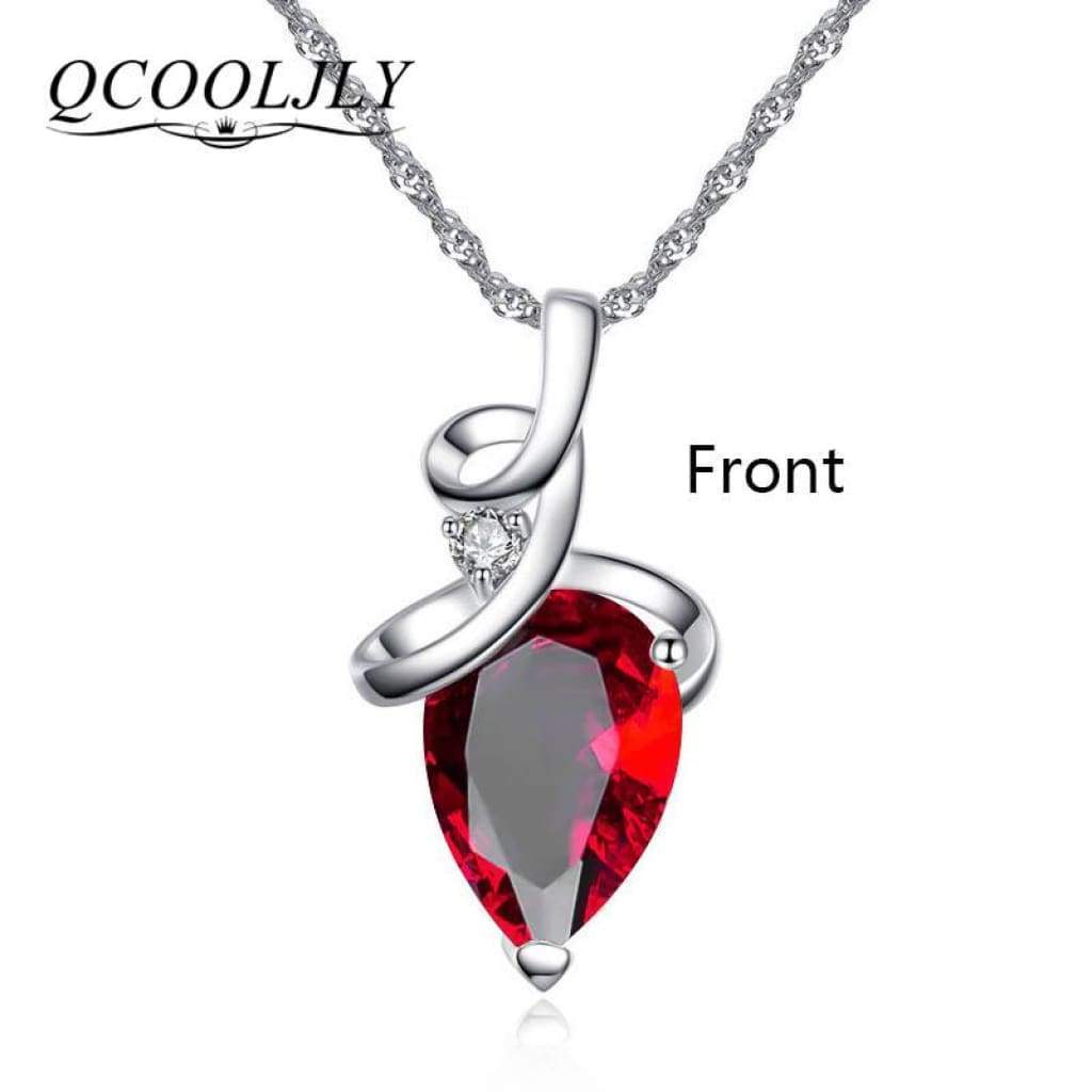 Silver pendant necklace with red pear gemstone and diamond accent