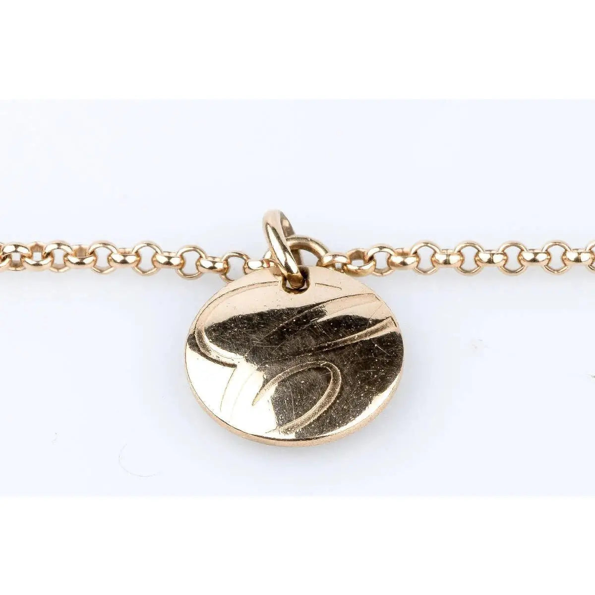 Gold shark tooth charm bracelet displayed in TESTING 5 IMAGES product photo