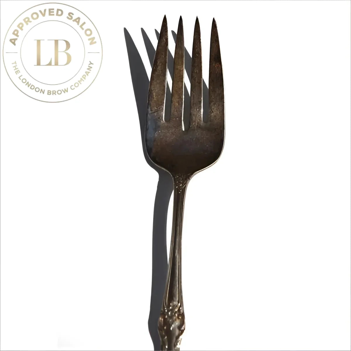 Fork adorned with a black bow tie alongside the elegant White Diamond Hat