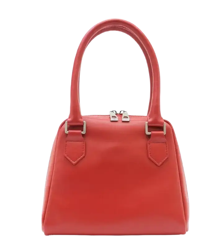 Balancing Facial Toner in sleek coral-red leather handbag with silver hardware