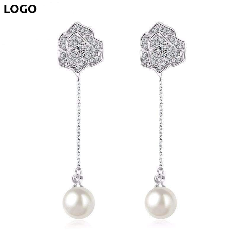 Silver floral pearl drop earrings with cubic zirconia accents from Zip Product